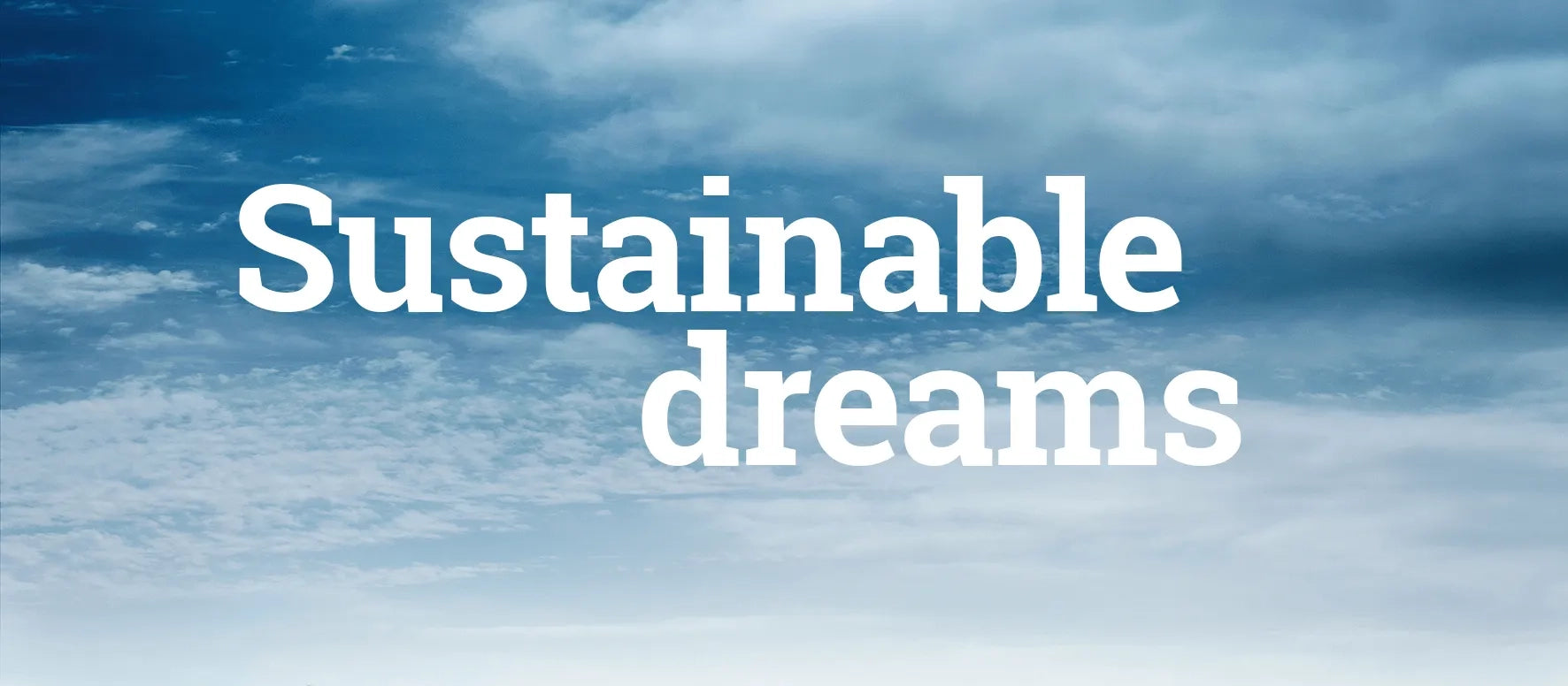 Text 'Sustainable dreams' against a blue sky with clouds