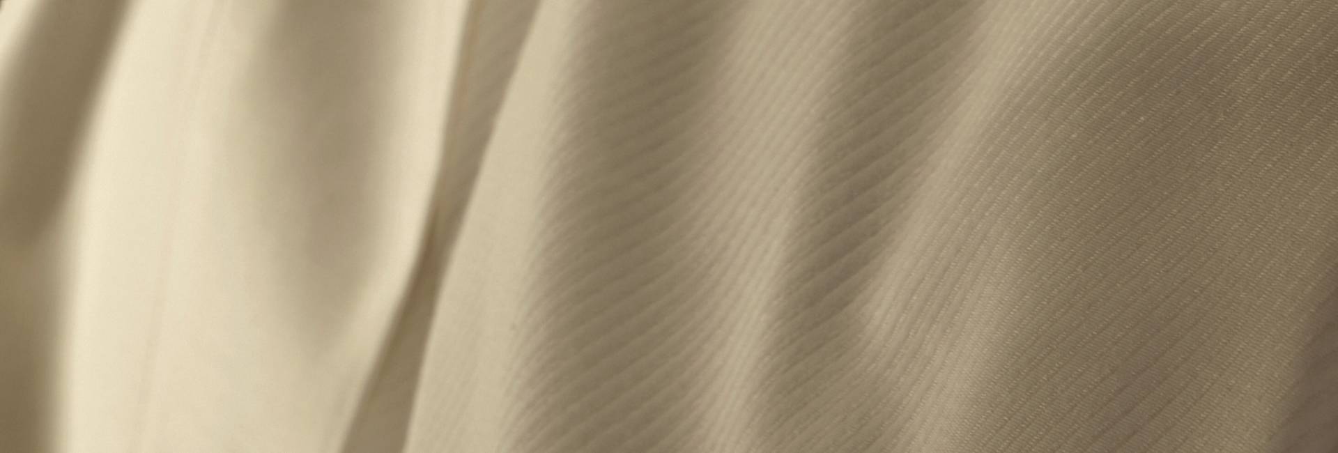 Close-up of beige fabric with folds